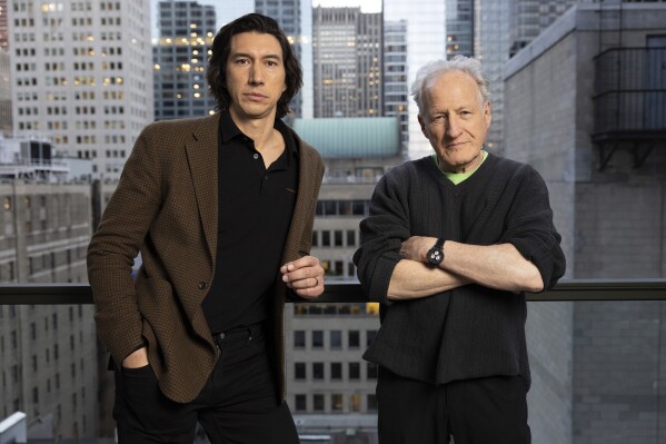 Adam Driver, left, and director Michael Mann pose for a portrait to promote "Ferrari" on Thursday, Oct. 12, 2023, in New York. (Photo by Matt Licari/Invision/AP)