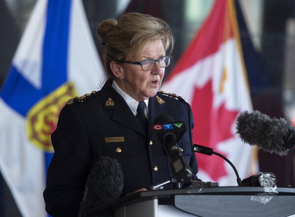 Assistant Commissioner Lee Bergerman, commanding officer of the Nova Scotia Royal Canadian Mounted Police, addresses a news conference at RCMP headquarters in Dartmouth, Nova Scotia, Sunday, April 19, 2020. Canadian police say multiple people are dead plus the suspect after a shooting rampage across the province of Nova Scotia. It was the deadliest shooting in Canada in 30 years. (Andrew Vaughan/The Canadian Press via AP)