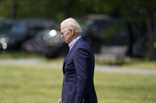 President Joe Biden walks to Marine One upon departure from the Ellipse at the White House, Saturday, May 22, 2021, in Washington. Biden is en route to Camp David. (AP Photo/Alex Brandon)