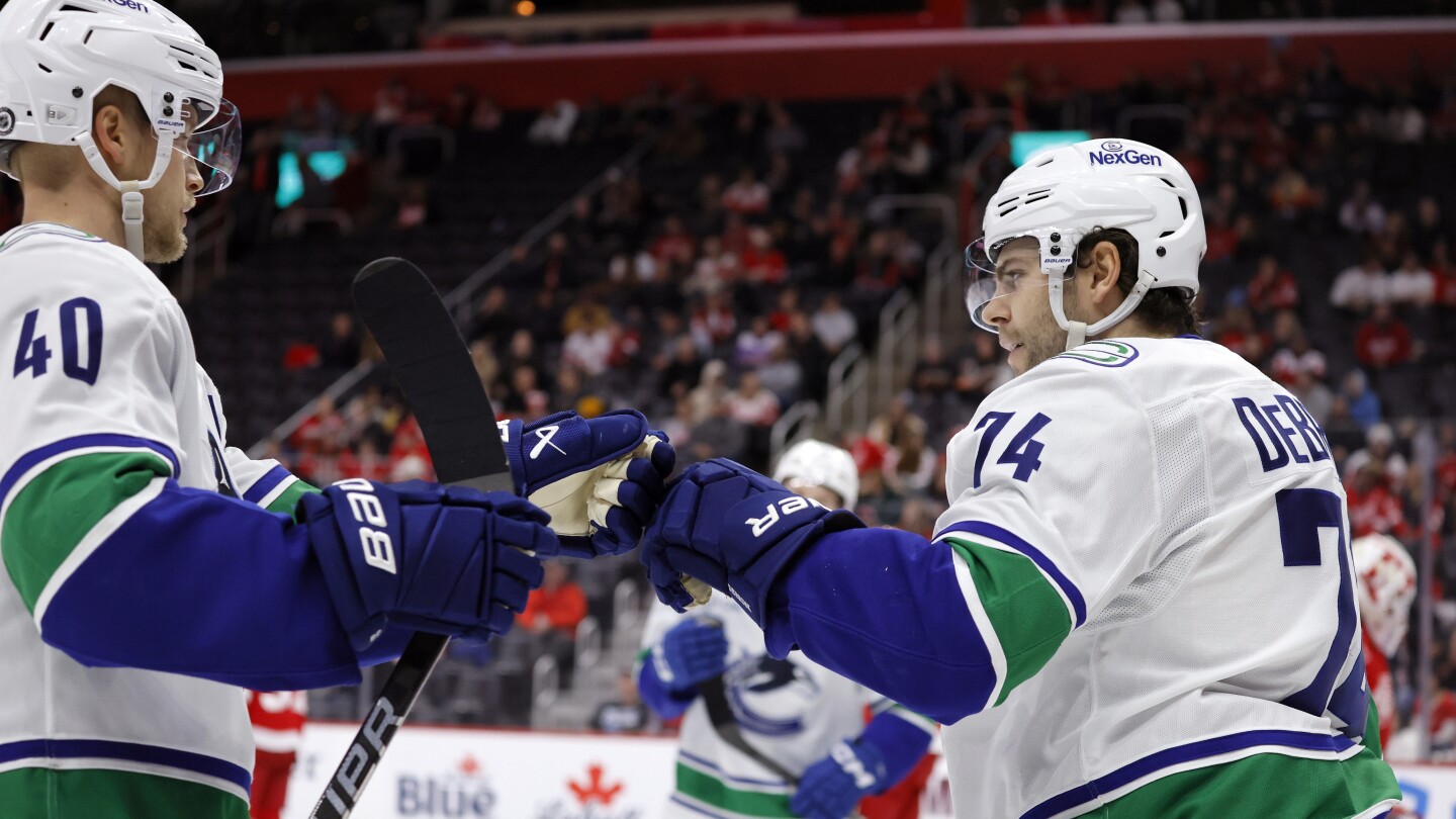 Canucks Edge Red Wings 5-4 in OT