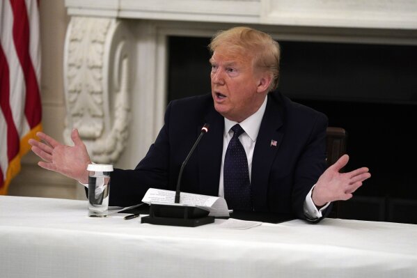 FILE - In this May 18, 2020 file photo, President Donald Trump tells reporters that he is taking zinc and hydroxychloroquine during a meeting with restaurant industry executives about the coronavirus response, in the State Dining Room of the White House in Washington. Results published Wednesday, June 3, 2020, by the New England Journal of Medicine show that hydroxychloroquine was no better than placebo pills at preventing illness from the COVID-19 coronavirus. The drug did not seem to cause serious harm, though - about 40% on it had side effects, mostly mild stomach problems. (AP Photo/Evan Vucci)