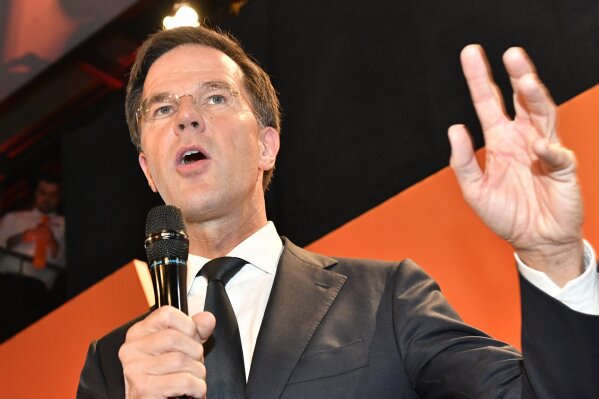 
              Prime Minister Mark Rutte of the free-market VVD party speaks to his supporters after exit poll results of the parliamentary elections were announced in The Hague, Netherlands, Wednesday, March 15, 2017. (AP Photo/Patrick Post)
            