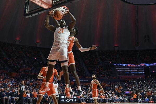 Illinois' Kofi Cockburn (21) dunks the ball during the first half of an NCAA college basketball game against Texas Rio Grande Valley Friday, Nov. 26, 2021, in Champaign, Ill. (AP Photo/Michael Allio)