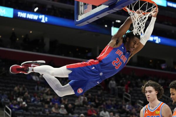 Detroit Pistons guard Jaden Ivey (23) dunks during the second half of an NBA basketball game against the Oklahoma City Thunder, Monday, Nov. 7, 2022, in Detroit. (AP Photo/Carlos Osorio)