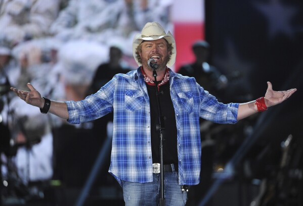 FILE - Toby Keith performs at ACM Presents an All-Star Salute to the Troops on April 7, 2024, in Las Vegas. Keith, who died on Monday, Feb. 5, 2024, of cancer at age 62, is being celebrated for his immense catalog of songs. But his 2002 track 鈥淐ourtesy Of The Red, White And Blue (The Angry American)" may be remembered most. (Photo by Chris Pizzello/Invision/AP, File)