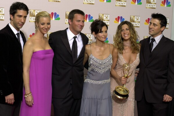 FILE - David Schwimmer, from left, Lisa Kudrow, Matthew Perry, Courteney Cox, Jennifer Aniston and Matt LeBlanc pose after "Friends" won outstanding comedy series at the 54th Primetime Emmy Awards on Sept. 22, 2002, in Los Angeles. Cast members are sharing more remembrances of Perry in their first personal social media posts since the actor’s death on Oct. 28. (AP Photo/Reed Saxon, File)