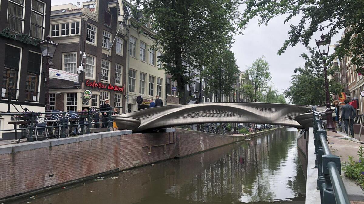 Dutch queen and robot open 3D-printed bridge in Amsterdam