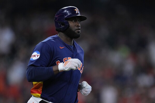 Houston Astros designated hitter Yordan Alvarez jogs to first base after hitting a two-run single during the third inning of a baseball game against the Seattle Mariners, Sunday, Aug. 20, 2023, in Houston. (AP Photo/Kevin M. Cox)