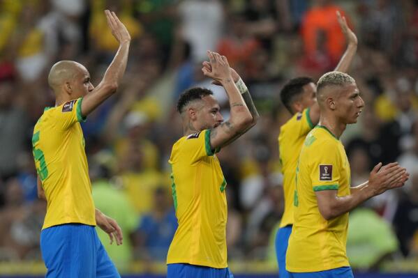 Brazil's Neymar, center, and teammates celebrate their 4-0 victory over Chile during a qualifying soccer match for the FIFA World Cup Qatar 2022 at Maracana stadium in Rio de Janeiro, Brazil, Thursday, March 24, 2022. (AP Photo/Silvia Izquierdo)