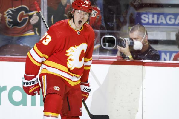 Calgary Flames' Tyler Toffoli celebrates his goal against the Minnesota Wild during the first period of an NHL hockey game Saturday, Feb. 26, 2022, in Calgary, Alberta. (Jeff McIntosh/The Canadian Press via AP)
