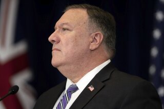 Secretary of State Mike Pompeo listens during a news conference at the State Department Tuesday, July 28, 2020, in Washington. (Brendan Smialowski/Pool via AP)