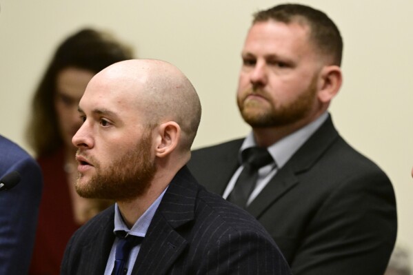 FILE - Former Officer Jason Rosenblatt, left, and Aurora Police Officer Randy Roedema, right, attend an arraignment at the Adams County Justice Center in Brighton, Colo., Jan. 20, 2023. The two officers face felony charges in the 2019 death of Elijah McClain. (Andy Cross/The Denver Post via AP, File)