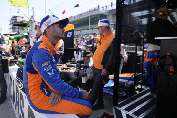 Kyle Larson sits on pit wall before a practice session for the Indianapolis 500 auto race at Indianapolis Motor Speedway, Friday, May 24, 2024, in Indianapolis. (AP Photo/Darron Cummings)