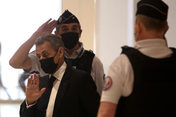 Former French President Nicolas Sarkozy arrives at the court room in Paris, Tuesday, June 15, 2021. Nicolas Sarkozy goes trial on charges that his unsuccessful reelection bid was illegally financed. (AP Photo/Rafael Yaghobzadeh)
