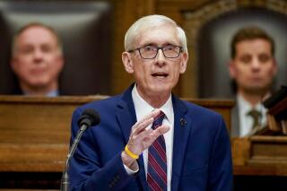 FILE - Wisconsin Gov. Tony Evers addresses a joint session of the Legislature in the Assembly chambers during the governor's State of the State speech at the state Capitol onn Tuesday, Feb. 15, 2022, in Madison, Wis. Wisconsin's Democratic governor told the state Supreme Court on Thursday, March 24, that it should allow him to submit additional evidence defending his legislative district boundary map that the U.S. Supreme Court rejected, arguing it is still better than the one submitted by the Republican Legislature.(AP Photo/Andy Manis, File)