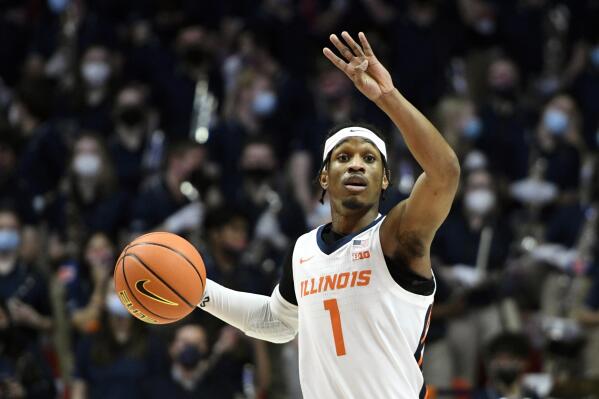 Illinois' Trent Frazier sets up a play during the first half of an NCAA college basketball game against Michigan State, Tuesday, Jan. 25, 2022, in Champaign, Ill. (AP Photo/Michael Allio)
