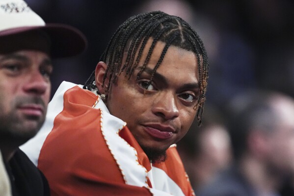 New York Jets quarterback Justin Fields attends an NBA basketball game between the New York Knicks and the Philadelphia 76ers Tuesday, April 1, 2025, in New York. (AP Photo/Frank Franklin II, file)