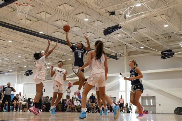 West Virginia Thunder's Darianna Alexander (9) shoots past California Storm Taurasi defenders during their game at the NCAA College Basketball Academy, Saturday, July 29, 2023, in Memphis, Tenn. (AP Photo/George Walker IV)