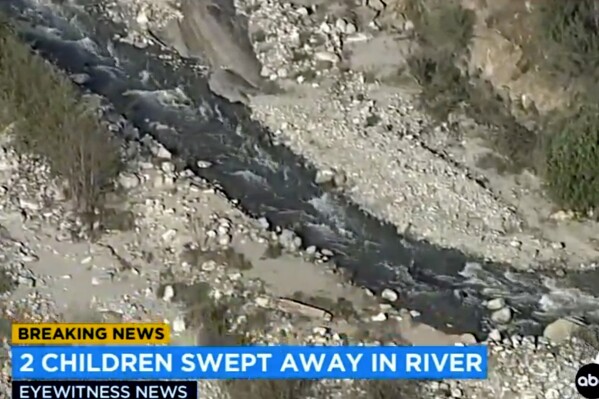 In this aerial still image provided by KABC-TV, shows a rapidly flowing creek in Southern California's San Bernardino Mountains where two young siblings died after being swept away by the rapidly flowing creek, authorities said. The San Bernardino County Sheriff's Department says the tragedy occurred Tuesday, May 7, 2024, when a mother took her 4-year-old daughter and 2-year-old son to spend the afternoon at a picnic area on Highway 38 near Mill Creek. (KABC-TV via AP)