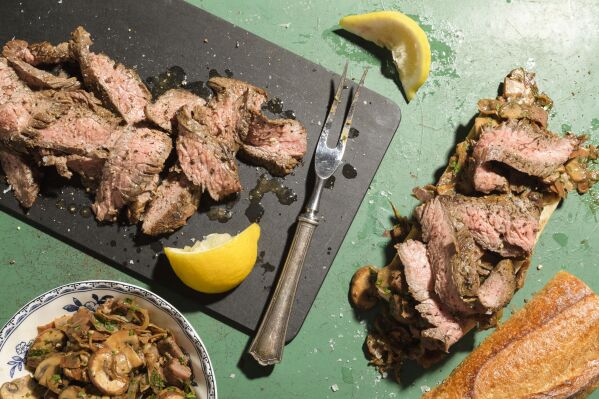 This image released by Milk Street shows a recipe for bocadillos with flank steak and mushrooms. (Milk Street via AP)
