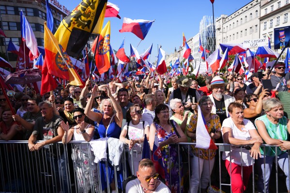 People gather for an anti-government demonstration at the Vencesla's Square in Prague, Czech Republic, Saturday, Sept. 16, 2023. Thousands of Czechs rallied on Saturday against the government demanding its resignation. (AP Photo/Petr David Josek)
