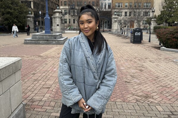 Lea Nepomuceno, 18, a freshman at George Washington University, poses on Saturday, March 2, 2024, in Washington, D.C. The Associated Press spoke with teenagers and young adults about their experiences on social media and what they wish they had known when they first got online. (AP Photo/Almaz Abedje)