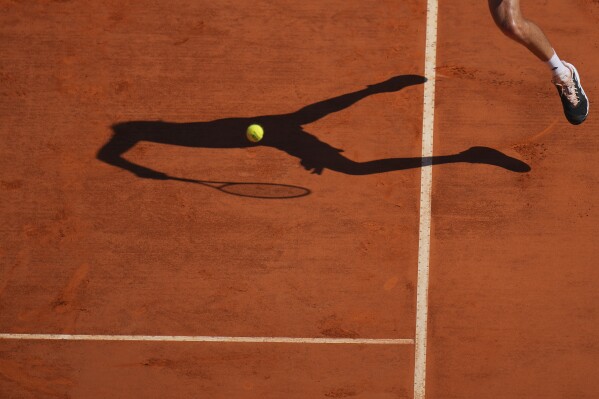 Stefanos Tsitsipas of Greece returns the ball to Casper Ruud of Norway during their Monte Carlo Tennis Masters final match in Monaco, Sunday, April 14, 2024. (AP Photo/Daniel Cole)