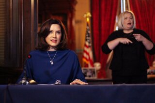 In a pool photo provided by the Michigan Office of the Governor, Michigan Gov. Gretchen Whitmer addresses the state during a speech in Lansing, Mich., Monday, March 30, 2020. (Michigan Office of the Governor via AP, Pool)