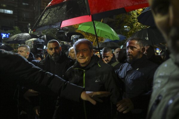 Opposition leader Sali Berisha joins his supporters during an anti-government protest, after he was released from the house arrest, asking for a technocratic caretaker Cabinet, in Tirana, Albania, Monday, Dec. 23, 2024. (AP Photo/Vlasov Sulaj)