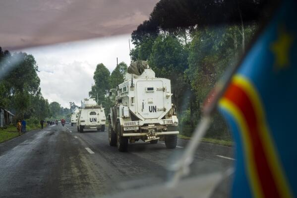 UN vehicles patrol the road leading to the front line in Goma, Democratic Republic of Congo Friday Nov. 25, 2022. Mediators are calling for a cease-fire to begin Friday evening in eastern Congo. But it remains unclear whether that will happen as M23 rebels officially were not included at Wednesday's summit in Angola. (AP Photo/Jerome Delay)