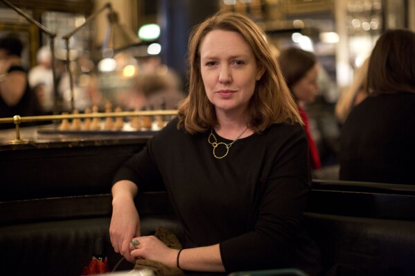 FILE - Paula Hawkins, author of "The Girl on the Train", poses for a portrait in London, on Feb. 19, 2015. Mariner Books, an imprint of HarperCollins Publishers, announced Wednesday that Hawkins’ “The Blue Hour” is scheduled for Oct. 8. (AP Photo/Matt Dunham, File