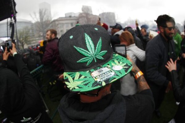 Attendees celebrate at Denver's Mile High 420 Festival on April 20. The annual celebration was projected to attract an estimated 50,000 people in Civic Center Park. (AP Photo/David Zalubowski)