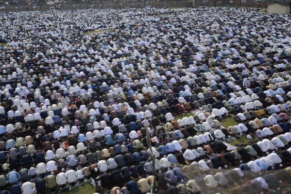 Muslims perform an Eid al-Fitr prayer, marking the end of the fasting month of Ramadan, in Karachi, Pakistan, Wednesday, April, 10, 2024. (AP Photo/Fareed Khan)