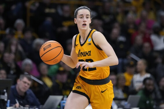FILE - Iowa guard Caitlin Clark drives upcourt during the team's first-round game against Southeastern Louisiana in the NCAA women's college basketball tournament March 17, 2023, in Iowa City, Iowa. Clark won the 93rd AAU James E. Sullivan Award on Tuesday night, Sept. 19, as the nation's top collegiate or Olympic athlete. Clark was honored at the New York Athletic Club. Voting by the public as well as the AAU Sullivan Award committee, AAU board of directors, sports media and past winners determined the winner. (AP Photo/Charlie Neibergall, File)
