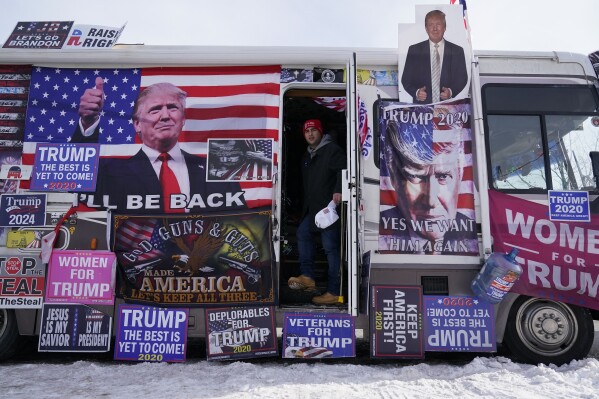 An RV, that is parked outside Team Trump New Hampshire headquarters, is visited by supporters, Saturday, Jan. 20, 2024, in Manchester, NH. (AP Photo/Pablo Martinez Monsivais)