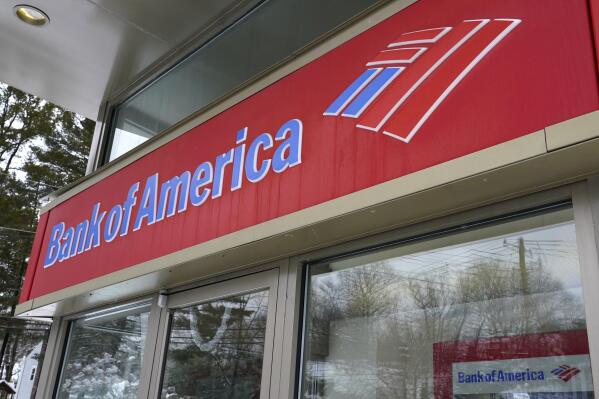 A Bank of America ATM is seen, Wednesday, Feb. 3, 2021, in Winchester, Mass. Bank of America topped Wall Street expectations for the third quarter Thursday, Oct. 14, 2021.   Bank of America said net income rose 58% to $7.26 billion, or 85 cents a share. That topped the estimates of Wall Street analysts who were looking for earning per share of 70 cents, according to FactSet. (AP Photo/Elise Amendola)