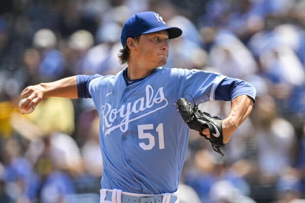 Kansas City Royals starting pitcher Brady Singer delivers during