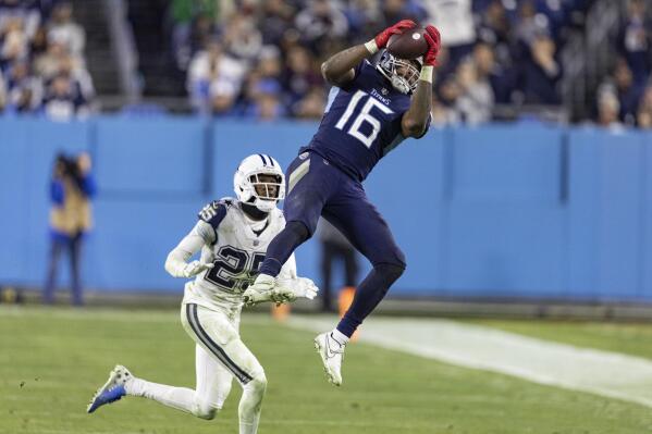 Tennessee Titans wide receiver Treylon Burks (16) unmakes a catch in front of Dallas Cowboys cornerback Nahshon Wright (25) during their game Friday, Dec. 30, 2022, in Nashville, Tenn. (AP Photo/Wade Payne)