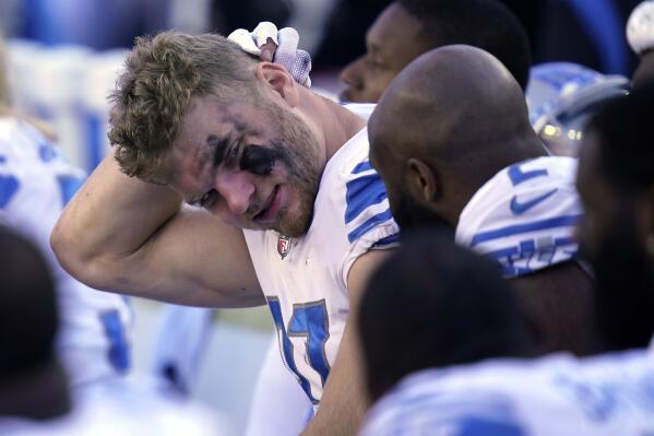 Detroit Lions defensive end Aidan Hutchinson, center left, speaks with teammates on the bench in the closing moments of the fourth quarter in an NFL football game against the New England Patriots, Sunday, Oct. 9, 2022, in Foxborough, Mass. (AP Photo/Charles Krupa)