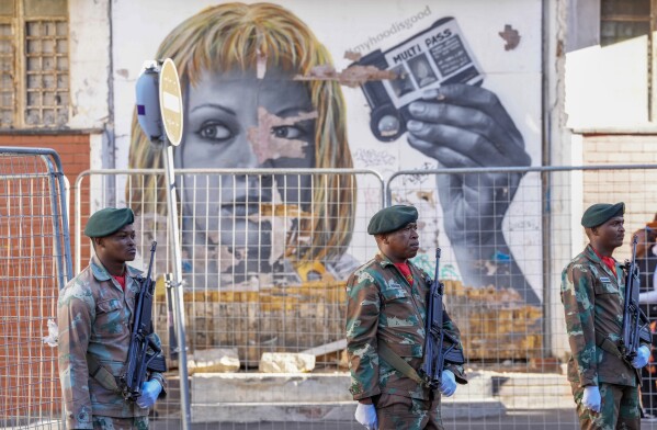 South African soldiers line the street leading to Cape Town's city hall where South African President Cyril Ramaphosa delivers his annual state of the union address, Thursday, Feb. 6, 2025. (AP Photo/Nardus Engelbrecht)