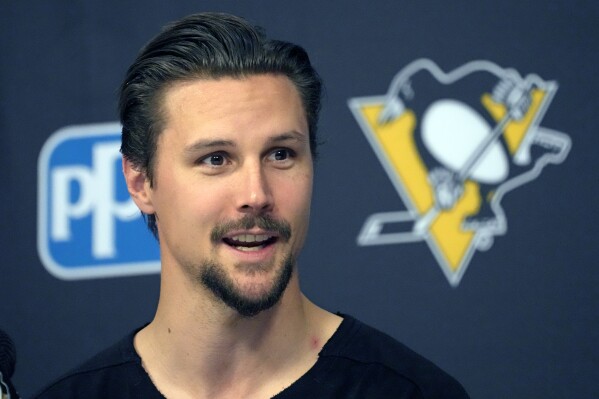 Newly acquired Pittsburgh Penguins defenseman Erik Karlsson holds his first meeting with reporters in Pittsburgh since being traded from the San Jose Sharks, Wednesday, Aug. 9, 2023. (AP Photo/Gene J. Puskar)