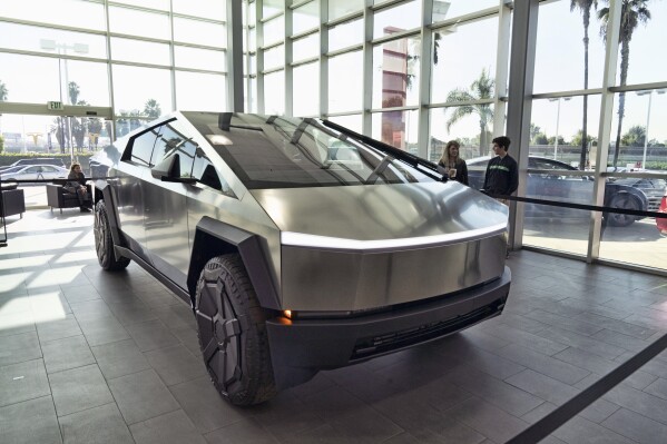 A Tesla Cybertruck is on display at the Tesla showroom in Buena Park, Calif., Dec. 3, 2023. (AP Photo/Richard Vogel, File)