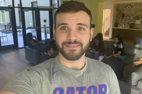 This photo provided by Jared Machado shows him at the Institute of Hispanic-Latino Cultures at the University of Florida in Gainesville, Fla., on Monday, Feb. 24, 2020. Like many young voters in Fl...