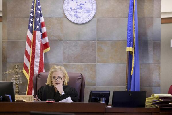 Clark County District Judge Michelle Leavitt listens in court in Las Vegas on Wednesday, Jan. 25, 2023, during a hearing for the Las Vegas Review-Journal to ask for sanctions on the Metropolitan Police Department for not informing the newspaper that investigators have searched the cellphone of slain reporter Jeff German. (K.M. Cannon/Las Vegas Sun via AP)