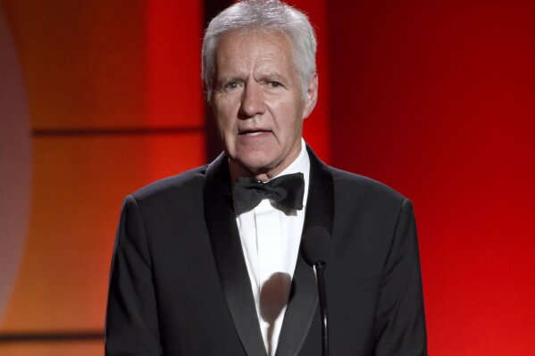 FILE - In this April 30, 2017, file photo, "Jeopardy!" host Alex Trebek speaks at the 44th annual Daytime Emmy Awards in Pasadena, Calif. Trebek has returned to work, saying he’s “on the mend” following treatment for pancreatic cancer. The 79-year-old posted a video Thursday, Aug. 29, 2019, on Twitter showing him back on the game show’s set. He actually started work on July 22, his birthday. New episodes of the upcoming Season 36 are slated to begin airing on Sept. 9. (Photo by Chris Pizzello/Invision/AP, File)