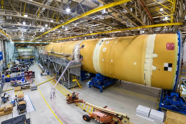 This August 2019 photo released by NASA, shows the core stage for NASA’s Space Launch System (SLS) rocket at the agency’s Michoud Assembly Facility in New Orleans. Kenneth Bowersox, acting associate administrator for human exploration, is casting doubt on the space agency's ability to land astronauts on the moon by 2024. Bowersox told a Congressional subcommittee Wednesday, Sept. 18, 2019, that NASA is doing its best to meet the White House-imposed deadline. But he says he wouldn't bet anything on it. (Eric Bordelon/NASA via AP)
