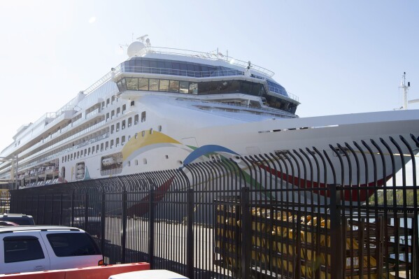 FILE - The cruise ship Norwegian Dawn is docked on May 22, 2015, at the Black Falcon Terminal in Boston. The U.S.-owned cruise ship with more than 3,000 passengers and crew onboard was finally allowed to dock in the Indian Ocean island of Mauritius on Monday Feb. 26, 2024, having been quarantined offshore over fears of an outbreak of the cholera disease onboard. (Mark Garfinkel/The Boston Herald via AP, File)