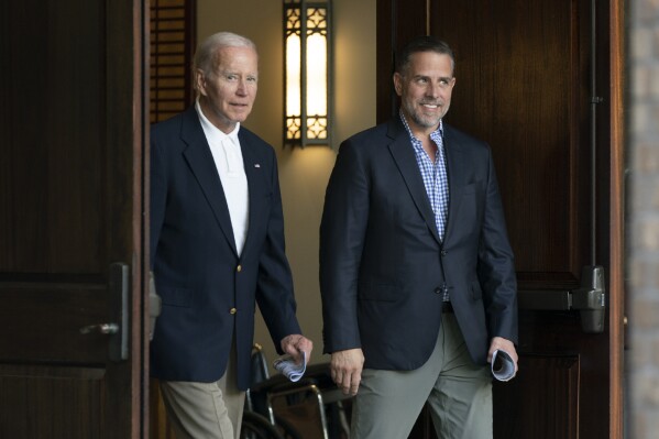 FILE - President Joe Biden and his son Hunter Biden leave Holy Spirit Catholic Church in Johns Island, S.C., after attending a Mass, Aug. 13, 2022. Hunter Biden is expected Wednesday to appear behind closed doors for a private deposition with the House committees leading the probe, apparently eager to fight back defending himself and his father from allegations of influence peddling of the family “brand” in his business dealings. (AP Photo/Manuel Balce Ceneta, File)