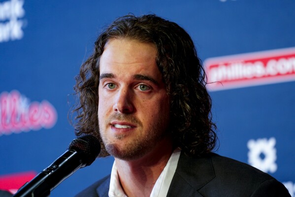 Philadelphia Phillies baseball team pitcher Aaron Nola takes questions from the media after signing a seven-year contract, Monday, Nov. 20, 2023, in Philadelphia. (AP Photo/Chris Szagola)