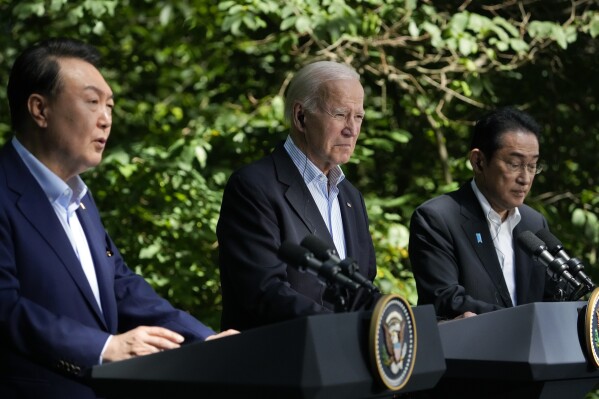 South Korea's President Yoon Suk Yeol, left, speaks during a joint news conference with President Joe Biden, center, and Japan's Prime Minister Fumio Kishida on Friday, Aug. 18, 2023, at Camp David, the presidential retreat, near Thurmont, Md. (AP Photo/Andrew Harnik)
